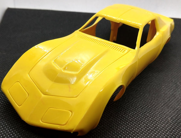 Yellow corvette toy store car