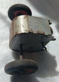 Friction motor with axle and wheels.