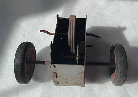 Friction motor with axle and wheels.