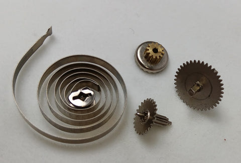 Lot of gears and spring. 3 Pieces