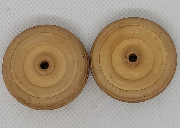 Two original 1-1/2" Cream wheels.  Hard rubber.