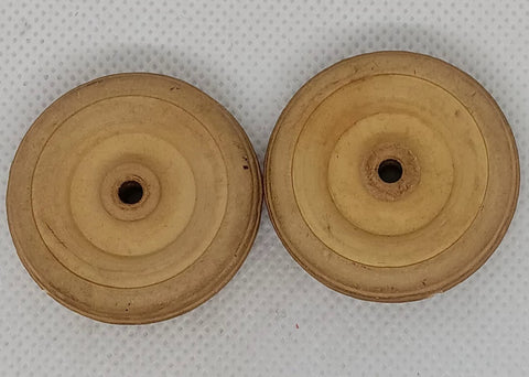 Two original 1-1/2" Cream wheels.  Hard rubber.