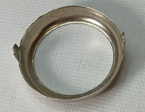 Tin toy connecting locking ring.  1-2/8" with 2 tabs.