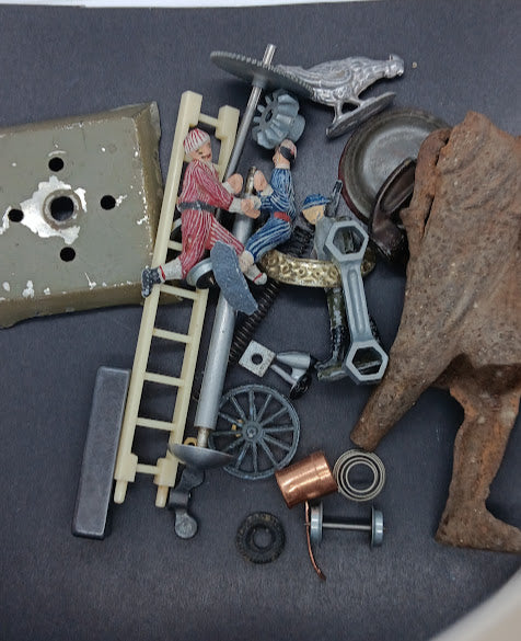 Lot of original toy and train parts and pieces.