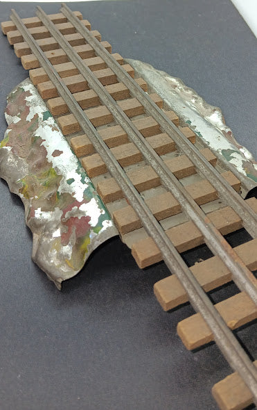 Original Marklin O gauge train spur with wooden center rail track.