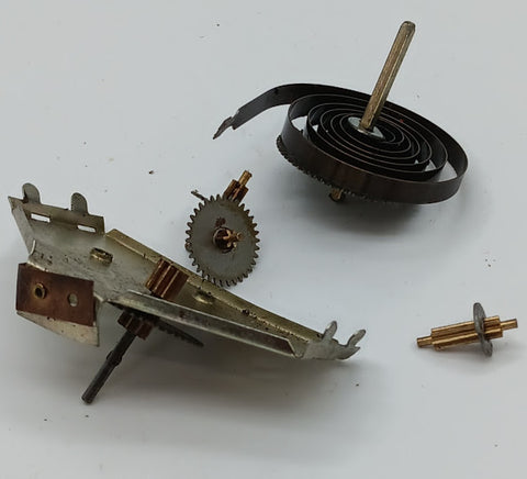 Vintage toy windup with spring and gears parts.