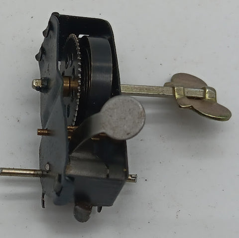 windup motor with spring and key.  Axle for wheels.