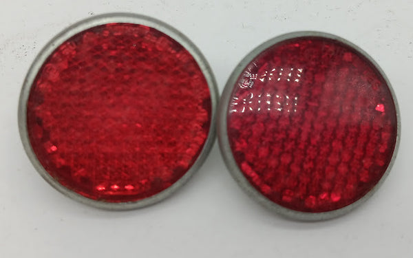 Set of two vintage toy bike pedal car reflectors.