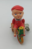 Tin windup toy boy on trike.  parts only.  windup works