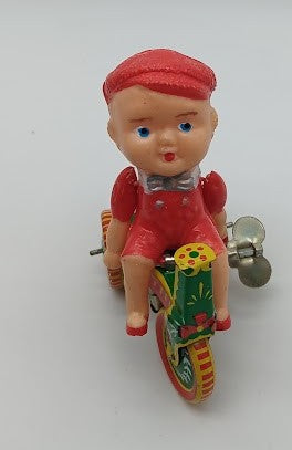Tin windup toy boy on trike.  parts only.  windup works