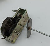 Vintage toy windup motor with shaft.