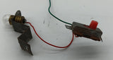 Original toy on/off Switch connected to 1.5 volt light bulb.