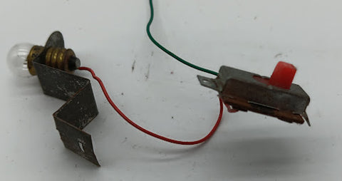 Original toy on/off Switch connected to 1.5 volt light bulb.