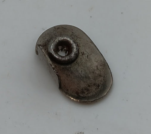 Original Battery compartment latch. 15/16 x 9/16" oval shape.