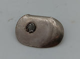 Original Battery compartment latch. 15/16 x 9/16" oval shape.