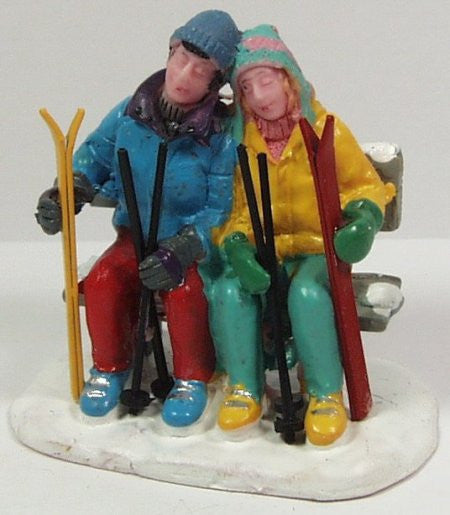 Boy & girl skiiers on bench figures : Standard ga & G ga