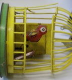 Vintage toy bird in a cage toy. Broken cage. Windup not working.