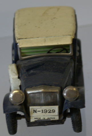 Vintage tin toy friction car.  1920's Dodge.  Good for parts. 7"