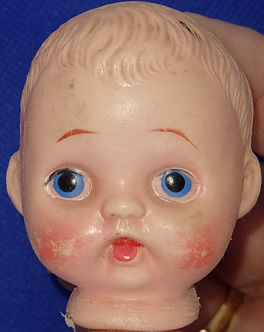 Vintage plastic doll head 2" x 1.5"  Original condition. Sold for parts only.