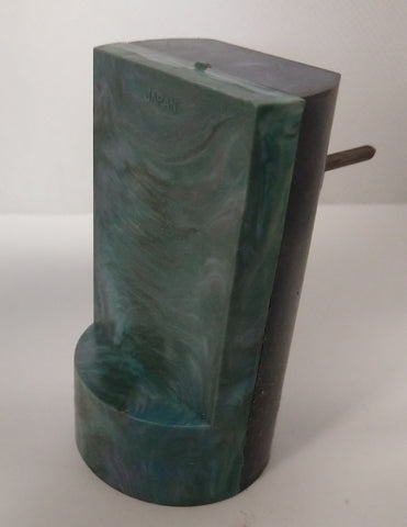 Vintage toy windup motor to make toy spin. Sealed unit with windup.