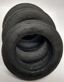 Set of four race car tires. 3-1/4" Diameter.